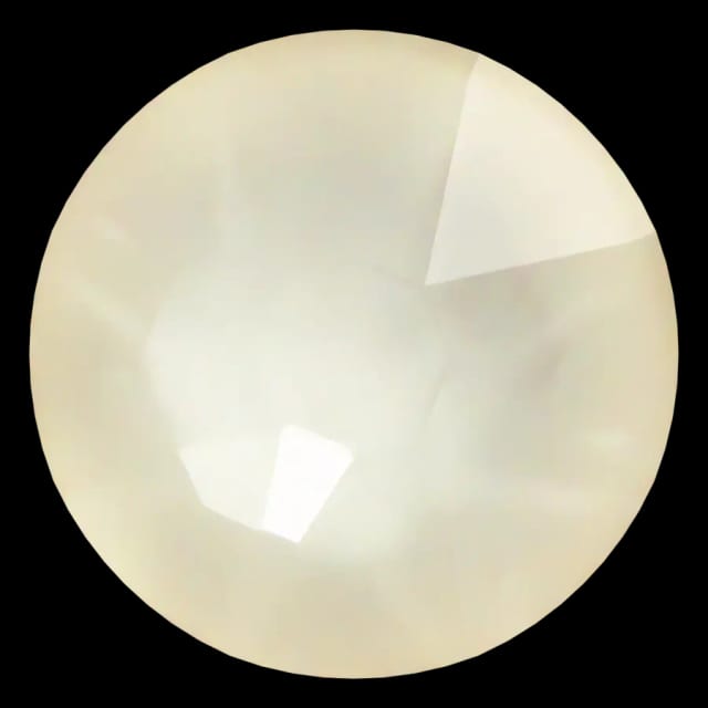Cristal rond beige lin pour bijou dentaire, vu de face