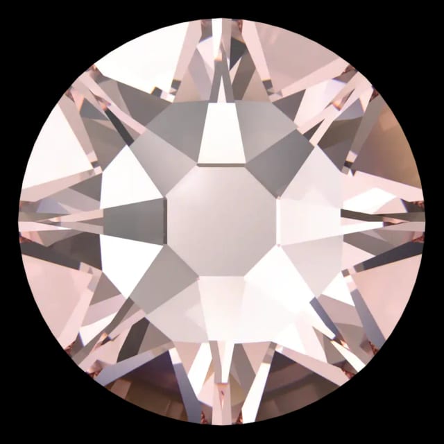 Cristal rond rose poudré pour bijou dentaire, vu de face